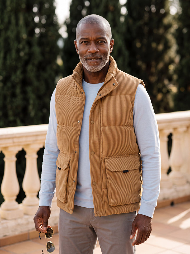 Nolan vest in Camel, worn by a model in a Mediterranean setting - Gentlemens Manor lifestyle