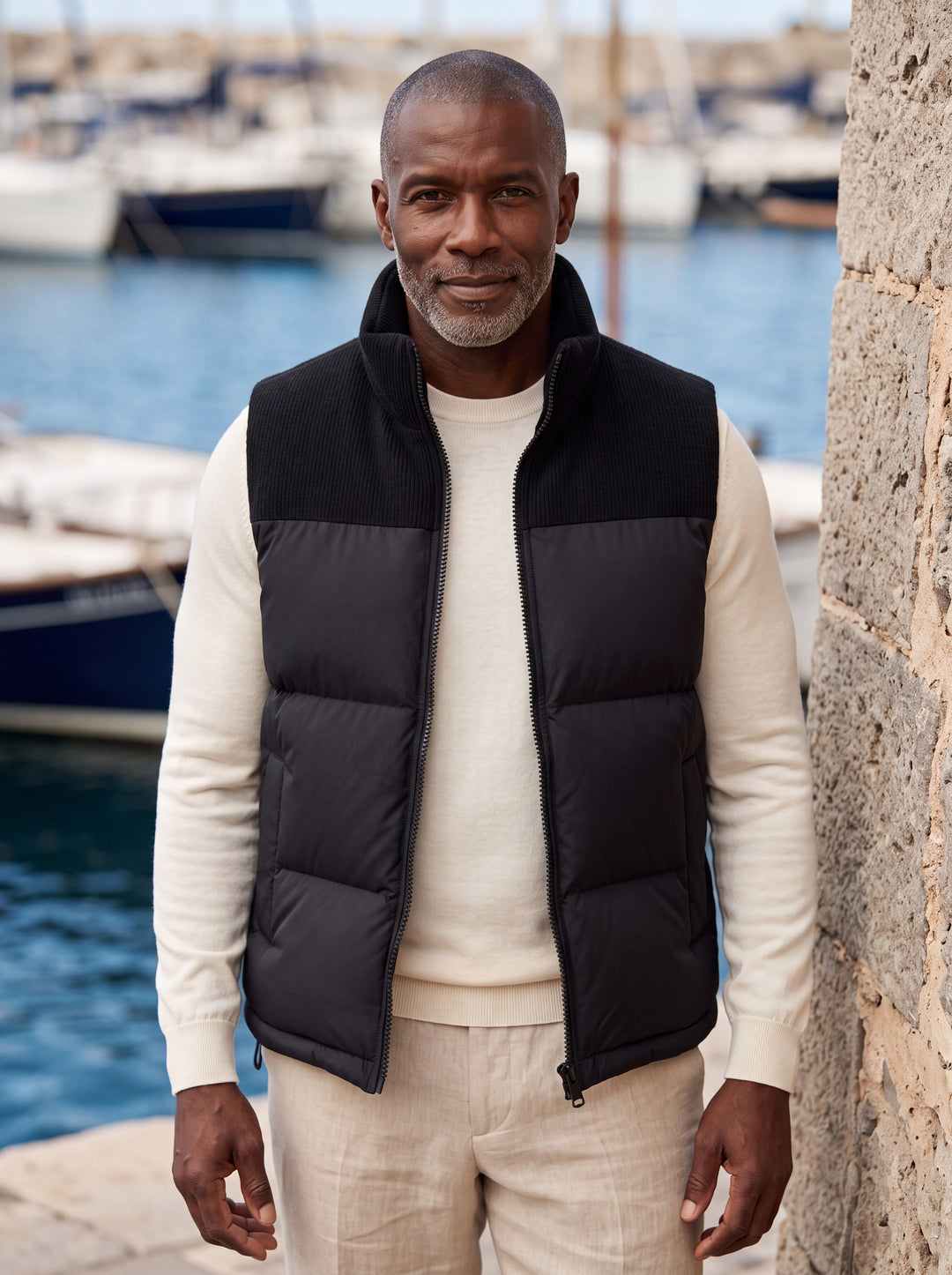 Norbert vest in Black, worn by a model in a Mediterranean setting - Gentlemens Manor lifestyle