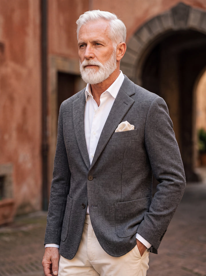 Norman blazer in Grey, worn by a model in a Mediterranean setting - Gentlemens Manor lifestyle