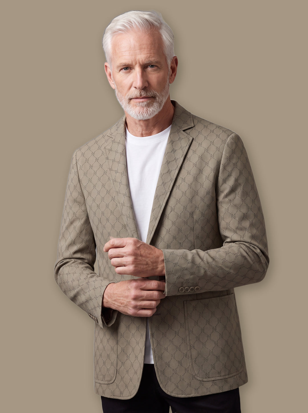 Norris blazer suit in Sand, worn by a model on a warm taupe studio background - Gentlemens Manor