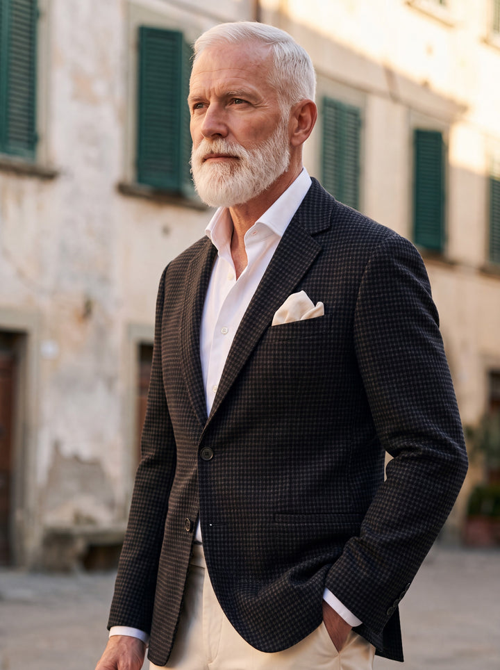 Norwood blazer in Black, worn by a model in a Mediterranean setting - Gentlemens Manor lifestyle