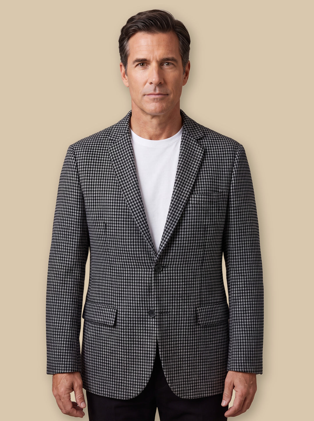 Norwood blazer suit in Grey, worn by a model on a warm sand studio background - Gentlemens Manor