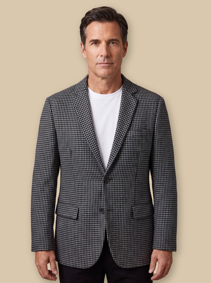 Norwood blazer suit in Grey, worn by a model on a warm sand studio background - Gentlemens Manor