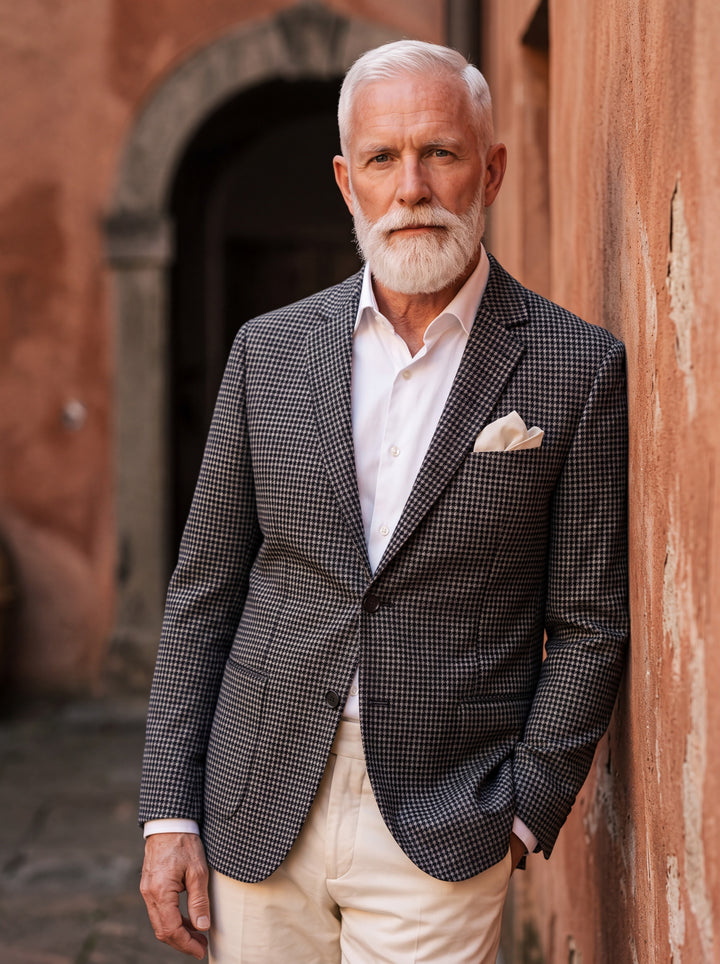 Norwood blazer in Grey, worn by a model in a Mediterranean setting - Gentlemens Manor lifestyle