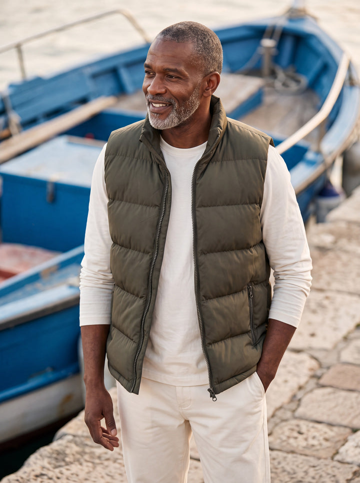 Odell vest in Olive, worn by a model in a Mediterranean setting - Gentlemens Manor lifestyle