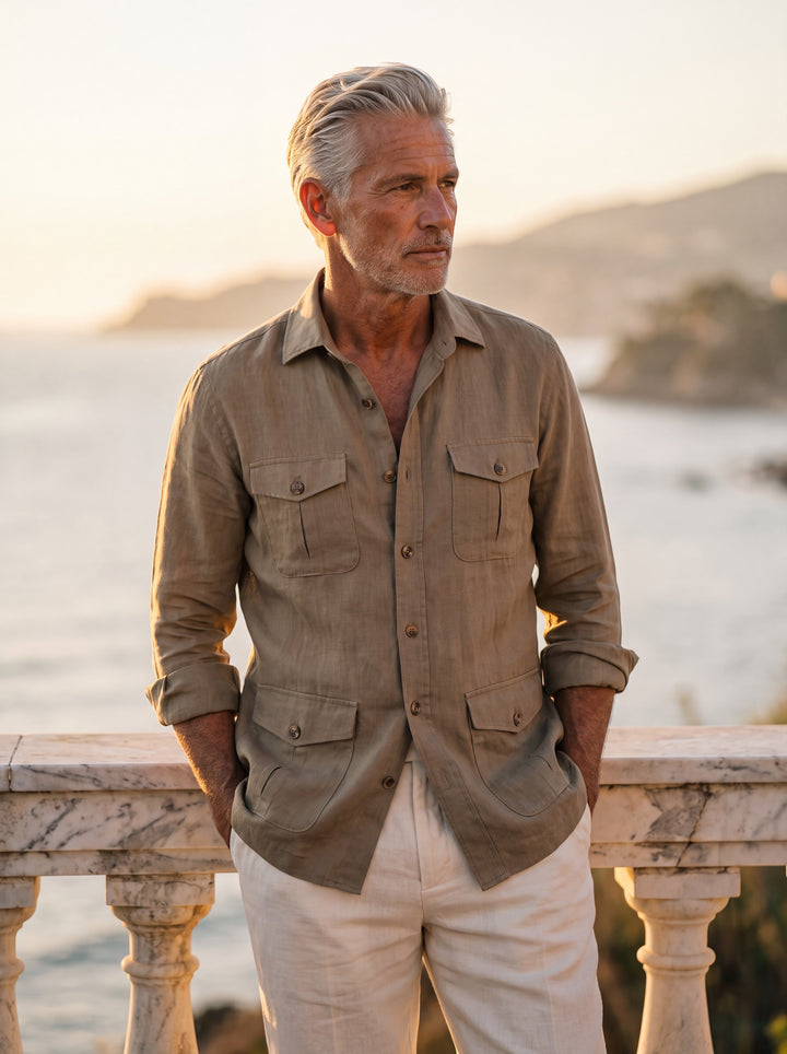 Ogden Men linen overshirt in Brown, worn by a model on a Mediterranean terrace - Gentlemens Manor lifestyle