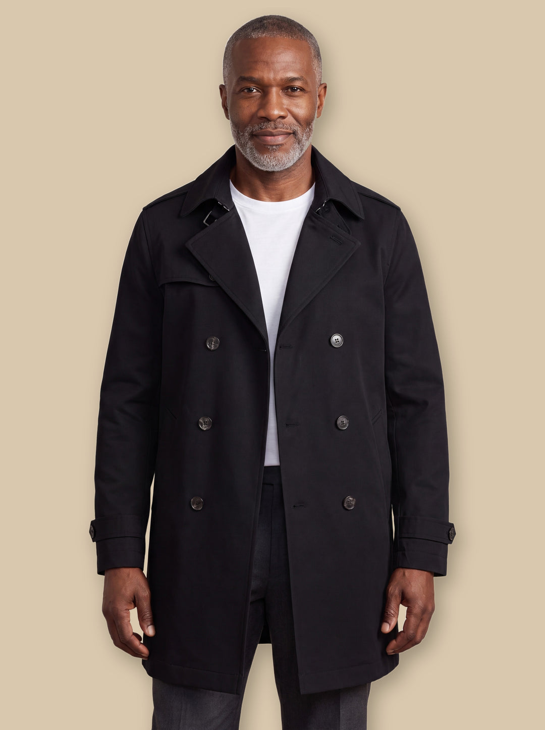 Oran jacket in Black, worn by a model on a warm sand studio background - Gentlemens Manor