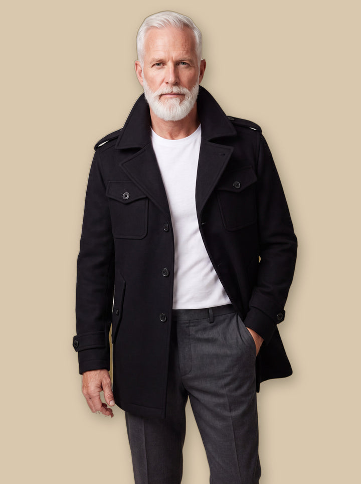 Orin jacket in Black, worn by a model on a warm sand studio background - Gentlemens Manor