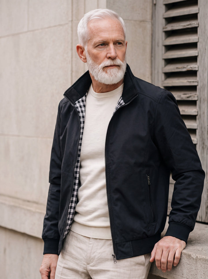 Orville jacket in Black, worn by a model in a Mediterranean setting - Gentlemens Manor lifestyle
