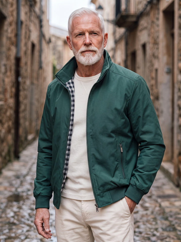 Orville jacket in Green, worn by a model in a Mediterranean setting - Gentlemens Manor lifestyle