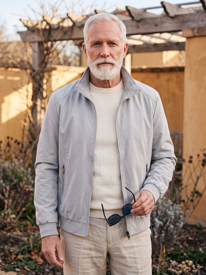 Orville jacket in Grey, worn by a model in a Mediterranean setting - Gentlemens Manor lifestyle