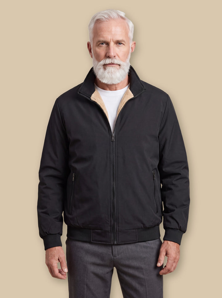 Osborn jacket in Black, worn by a model on a warm sand studio background - Gentlemens Manor