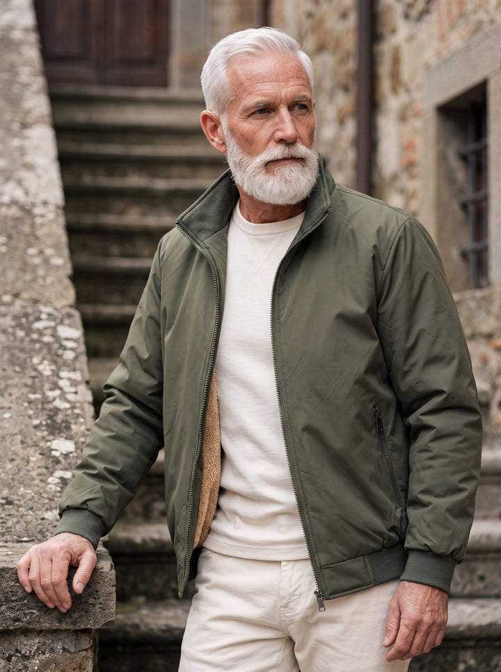 Osborn jacket in Green, worn by a model in a Mediterranean setting - Gentlemens Manor lifestyle