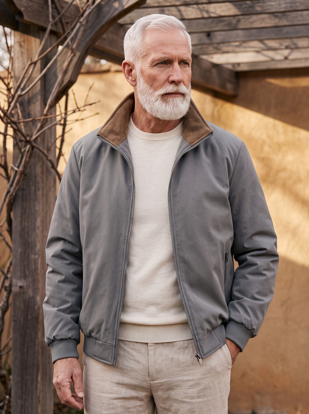 Osborn jacket in Grey, worn by a model in a Mediterranean setting - Gentlemens Manor lifestyle