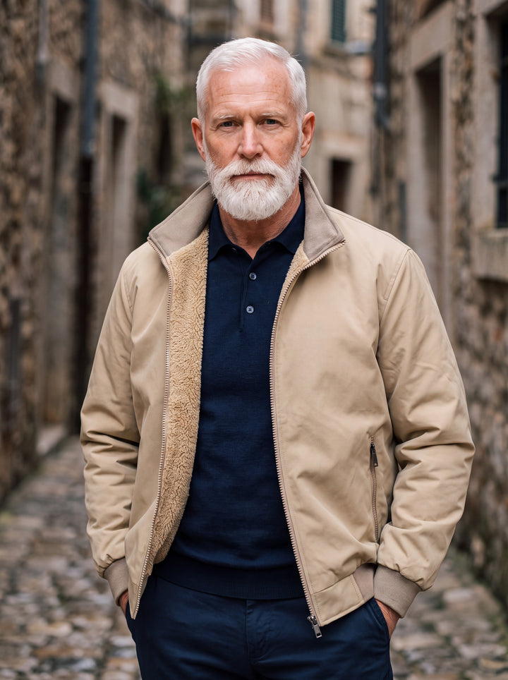 Osborn jacket in Sand, worn by a model in a Mediterranean setting - Gentlemens Manor lifestyle