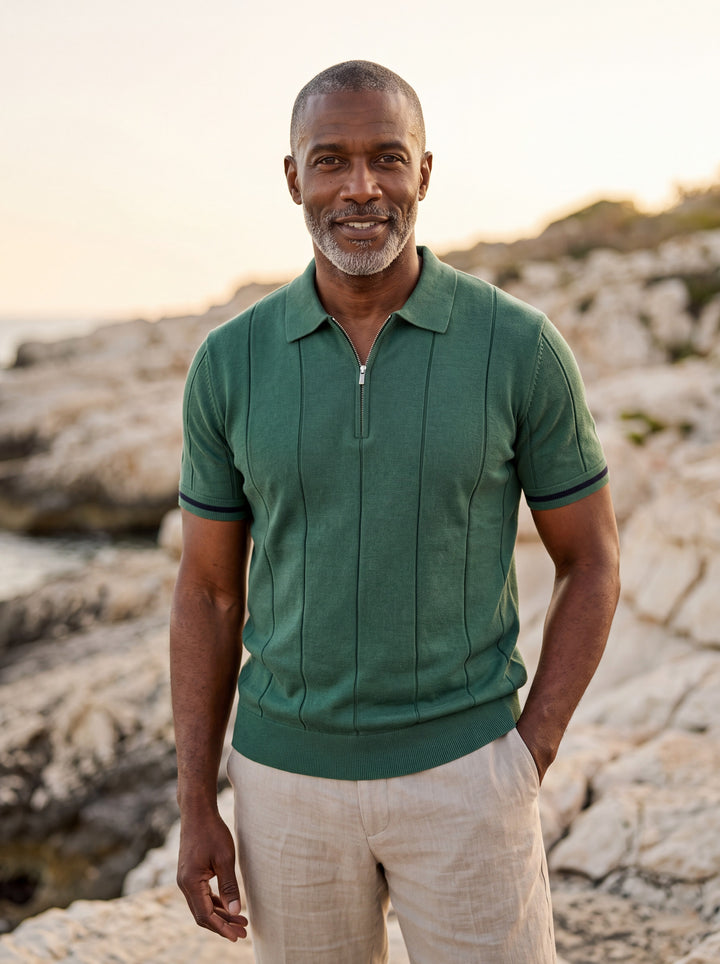 Otis Men polo shirt in green, worn by a model on a Mediterranean terrace - Gentlemens Manor lifestyle