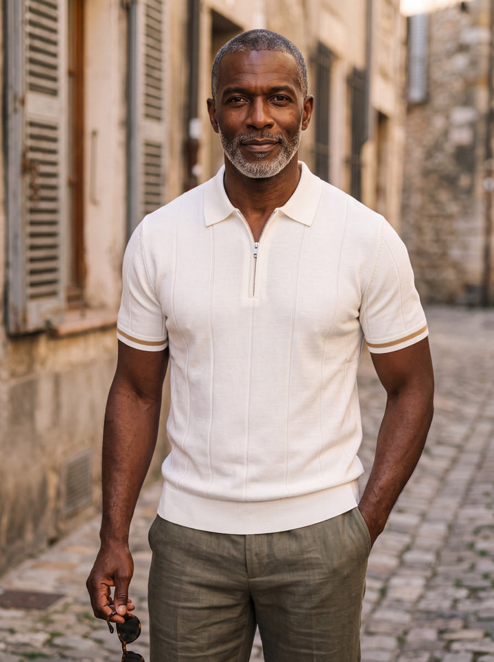 Otis Men polo shirt in white, worn by a model on a Mediterranean terrace - Gentlemens Manor lifestyle