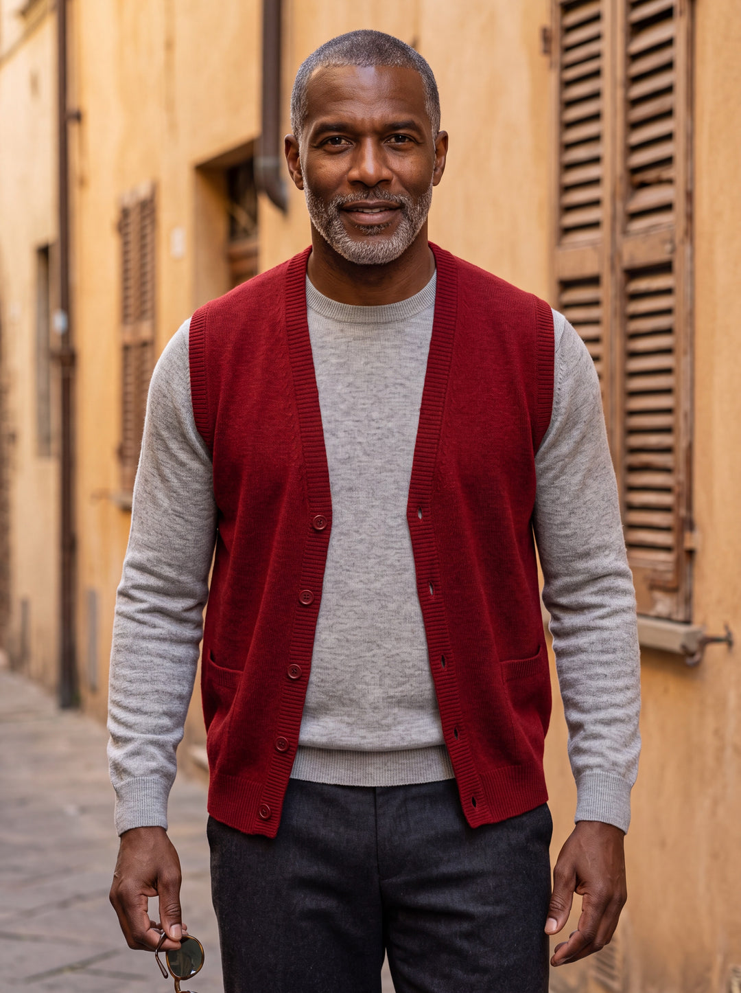 Otto vest in Red, worn by a model in a Mediterranean setting - Gentlemens Manor lifestyle