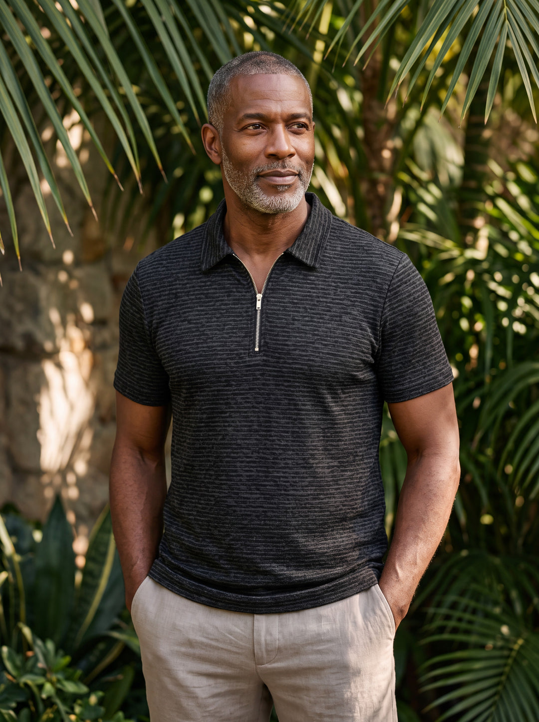 Parker Men polo shirt in black, worn by a model on a Mediterranean terrace - Gentlemens Manor lifestyle