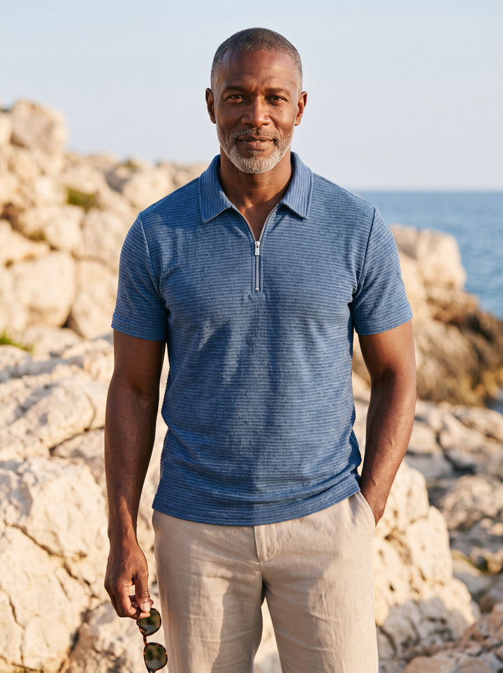 Parker Men polo shirt in blue, worn by a model on a Mediterranean terrace - Gentlemens Manor lifestyle
