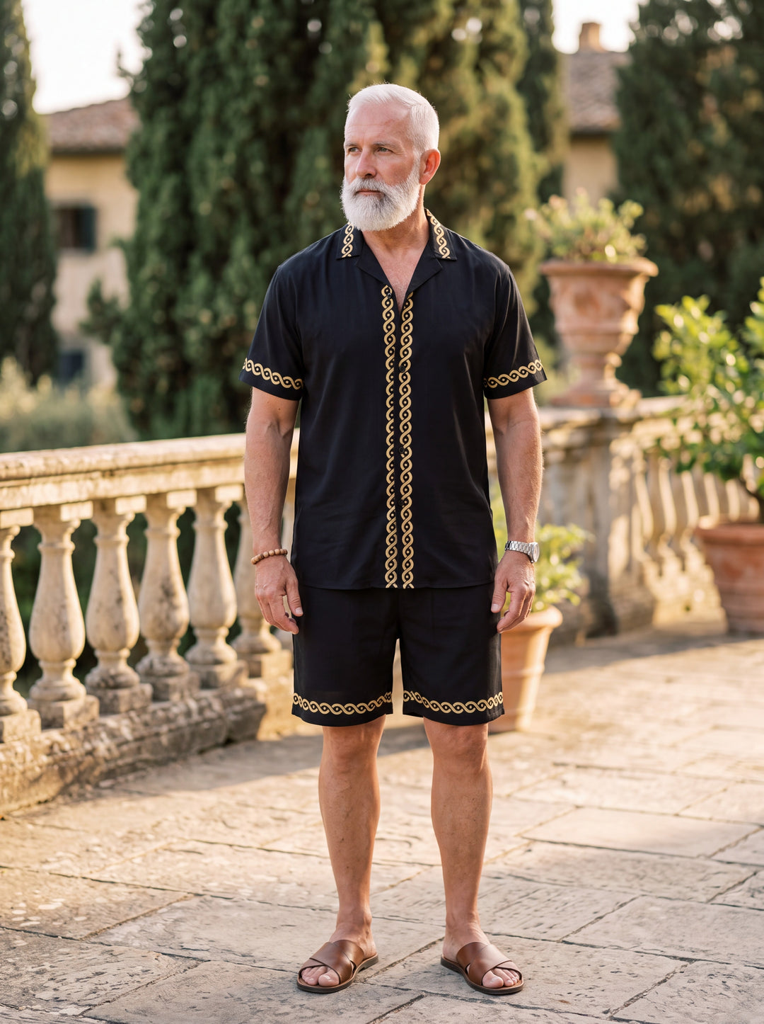 Parker Men two-piece summer set in black, worn by a model in a Mediterranean setting - Gentlemens Manor lifestyle