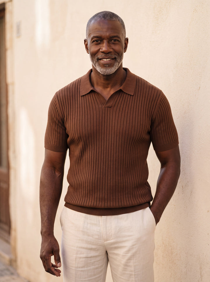 Paul Men polo shirt in brown, worn by a model on a Mediterranean terrace - Gentlemens Manor lifestyle