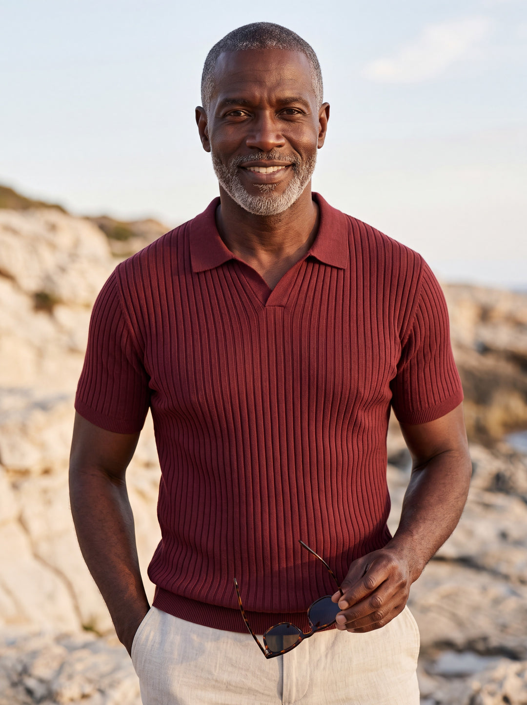 Paul Men polo shirt in burgundy, worn by a model on a Mediterranean terrace - Gentlemens Manor lifestyle