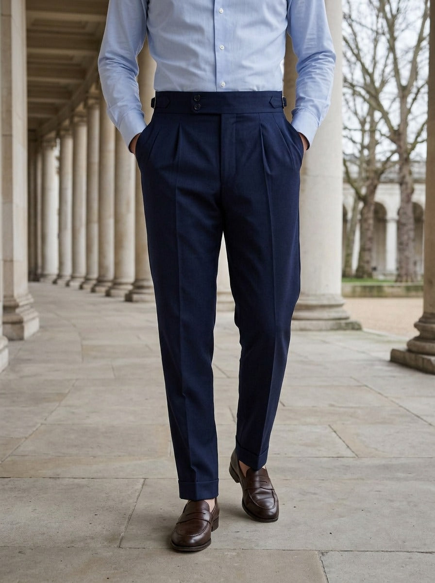 Paxton pleated trousers in Navy, lifestyle in a stone colonnade, Gentlemens Manor