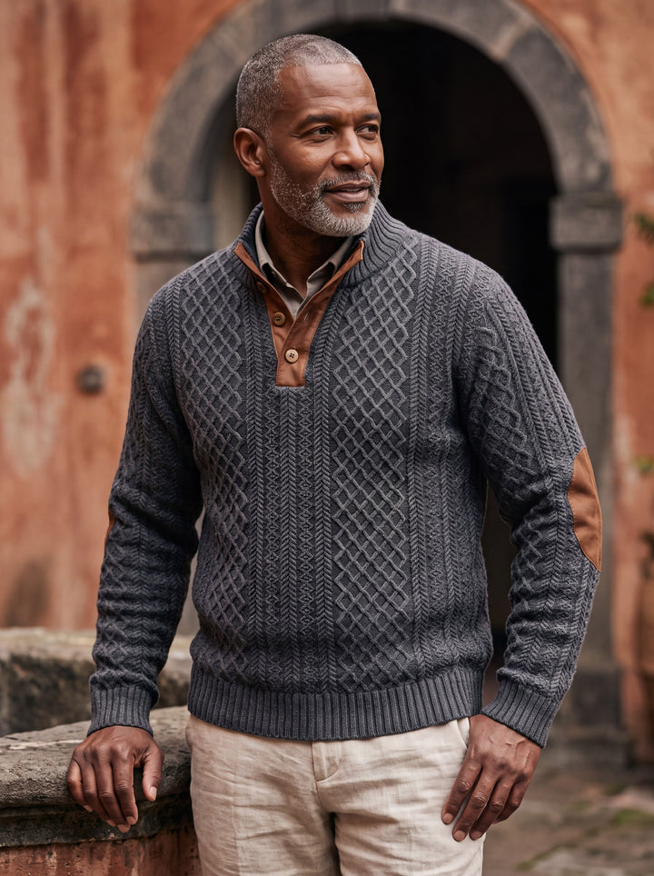 Pearce sweater in Charcoal, worn by a model in a Mediterranean setting - Gentlemens Manor lifestyle