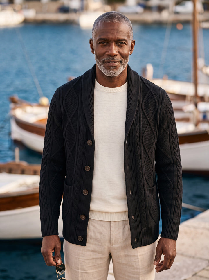 Percival cardigan in Black, worn by a model in a Mediterranean setting - Gentlemens Manor lifestyle
