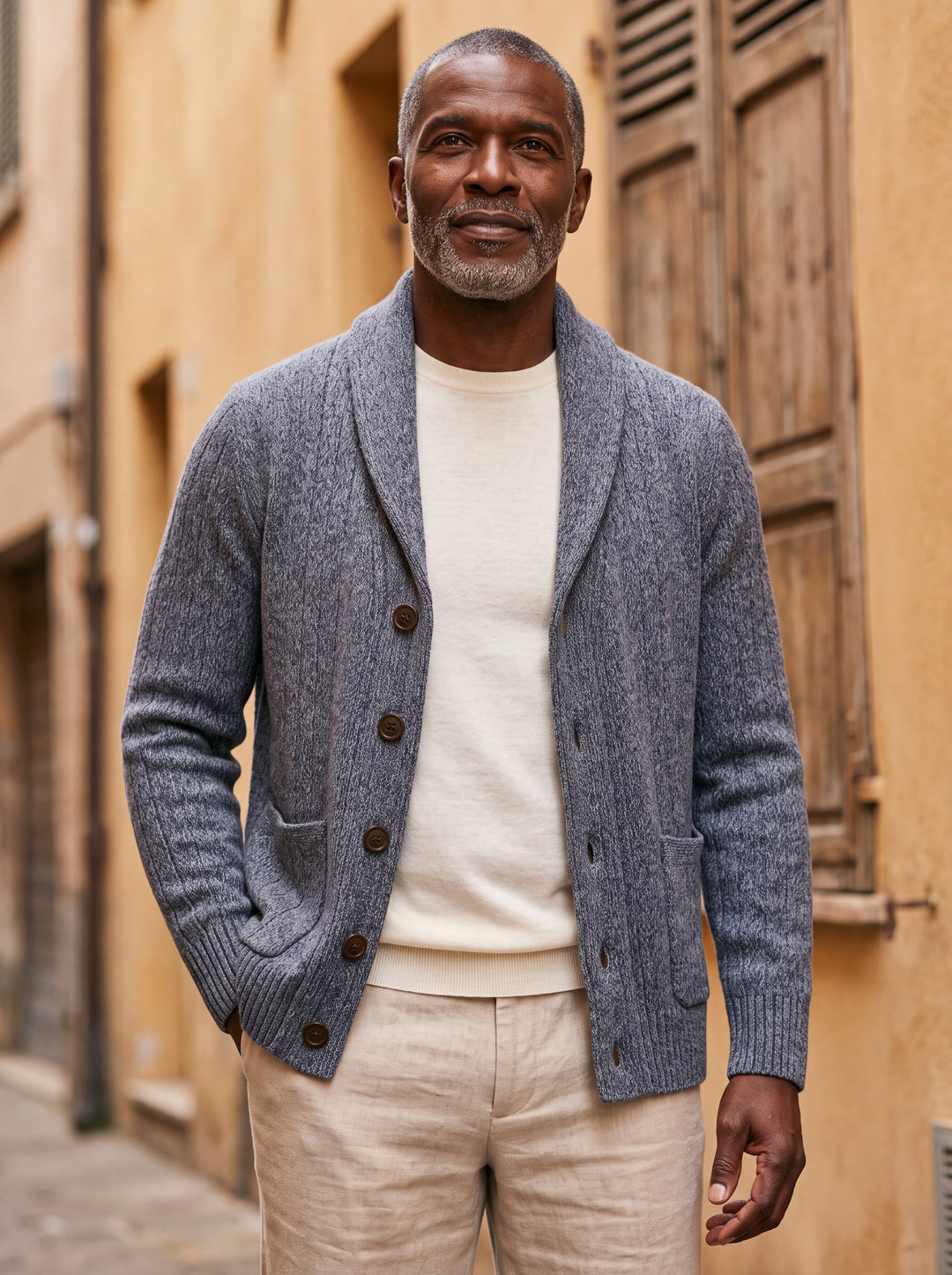 Percival cardigan in Grey, worn by a model in a Mediterranean setting - Gentlemens Manor lifestyle