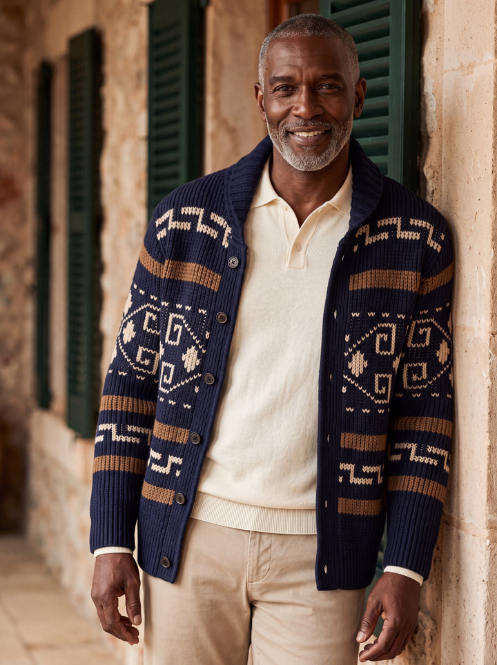 Percy cardigan in Navy, worn by a model in a Mediterranean setting - Gentlemens Manor lifestyle