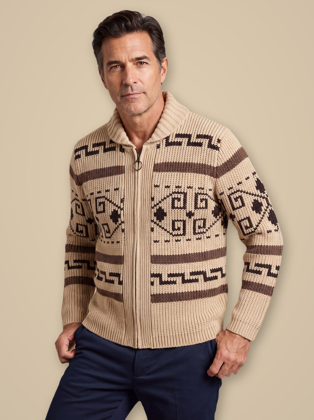 Percy knit sweater in Sand, worn by a model on a warm taupe studio background - Gentlemens Manor
