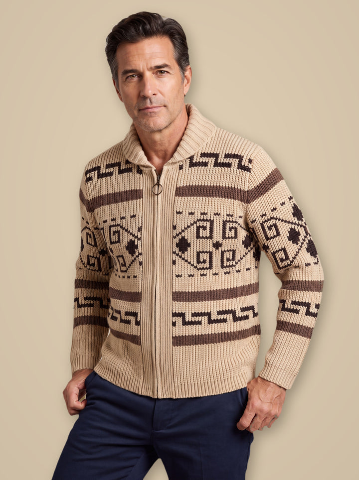 Percy knit sweater in Sand, worn by a model on a warm taupe studio background - Gentlemens Manor