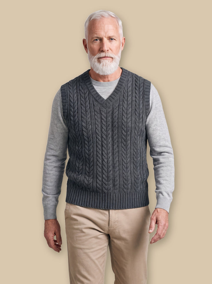 Perry knit sweater in Charcoal, worn by a model on a warm sand studio background - Gentlemens Manor
