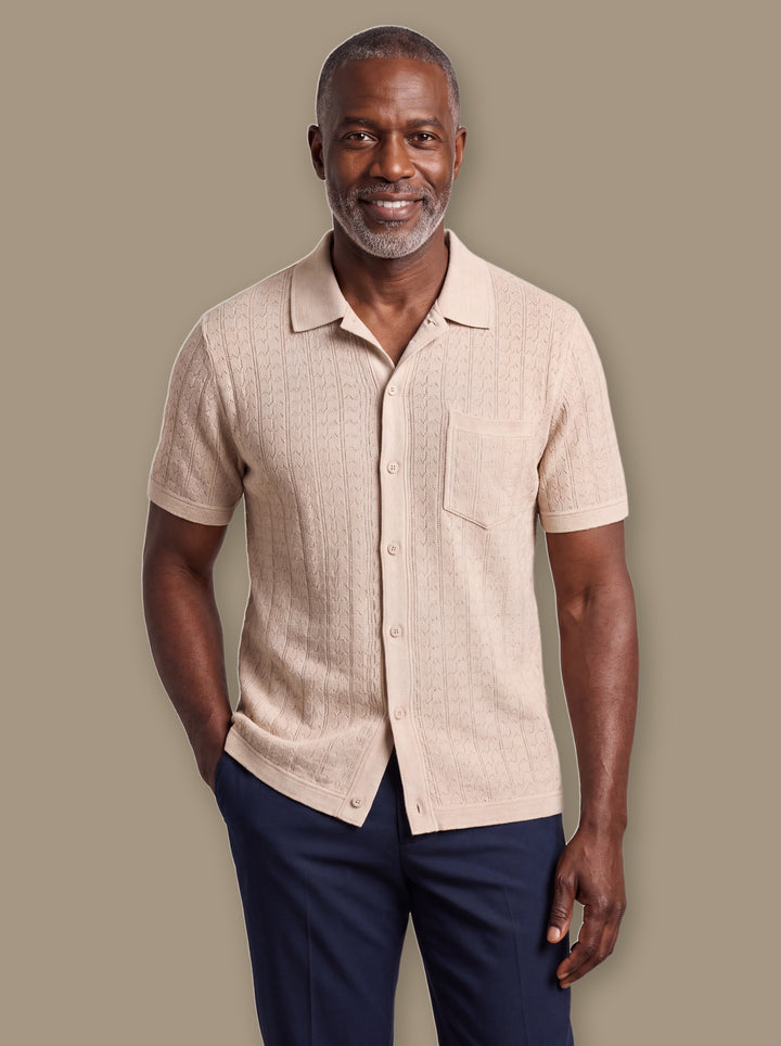 Peyton knit button-down shirt in Sand, worn by a model on a warm studio background - Gentlemens Manor