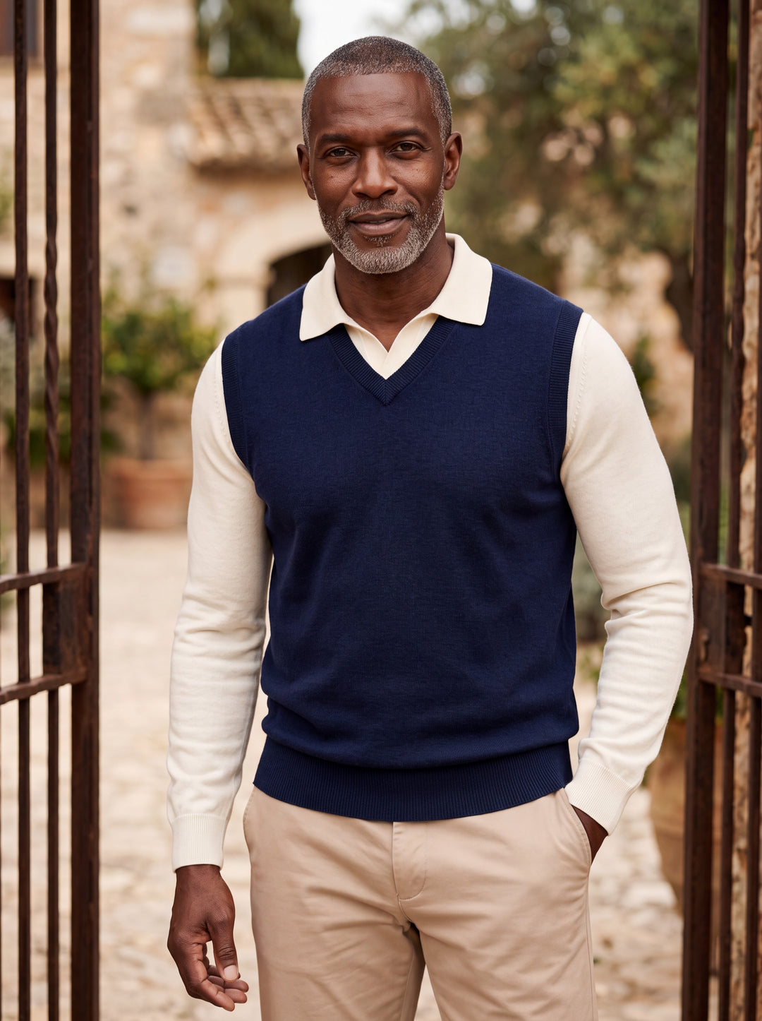 Phineas vest in Blue, worn by a model in a Mediterranean setting - Gentlemens Manor lifestyle