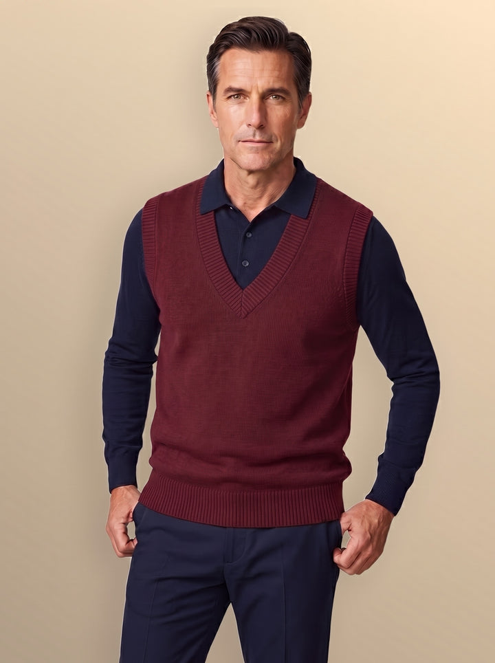 Phineas sweater vest in Burgundy, worn by a model on a warm sand studio background - Gentlemens Manor