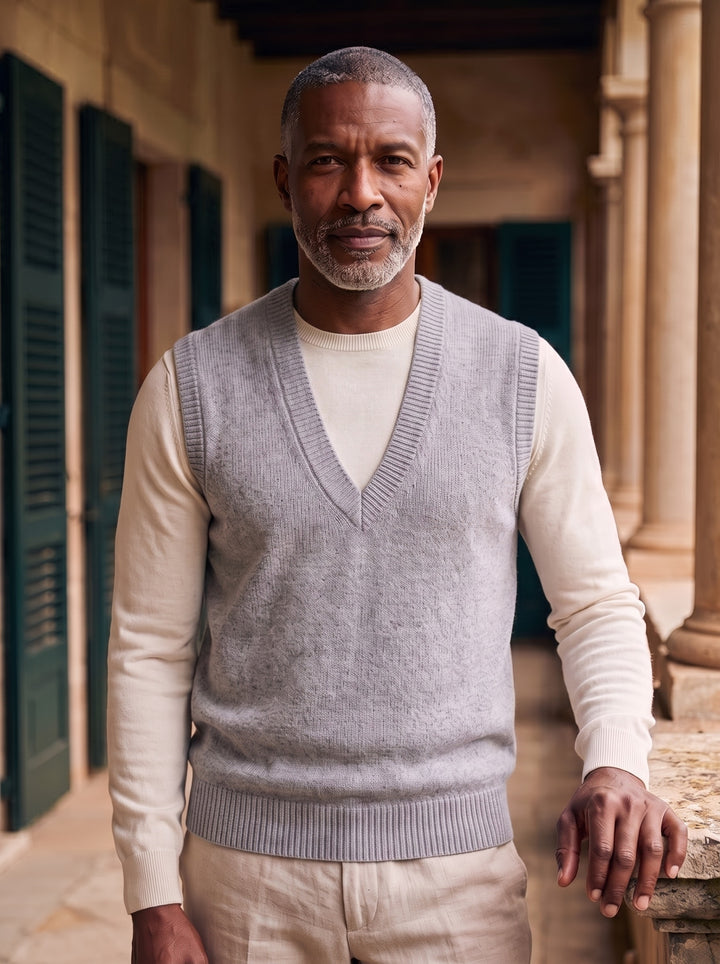 Phineas sweater vest in Grey, worn by a model in a Mediterranean setting - Gentlemens Manor lifestyle
