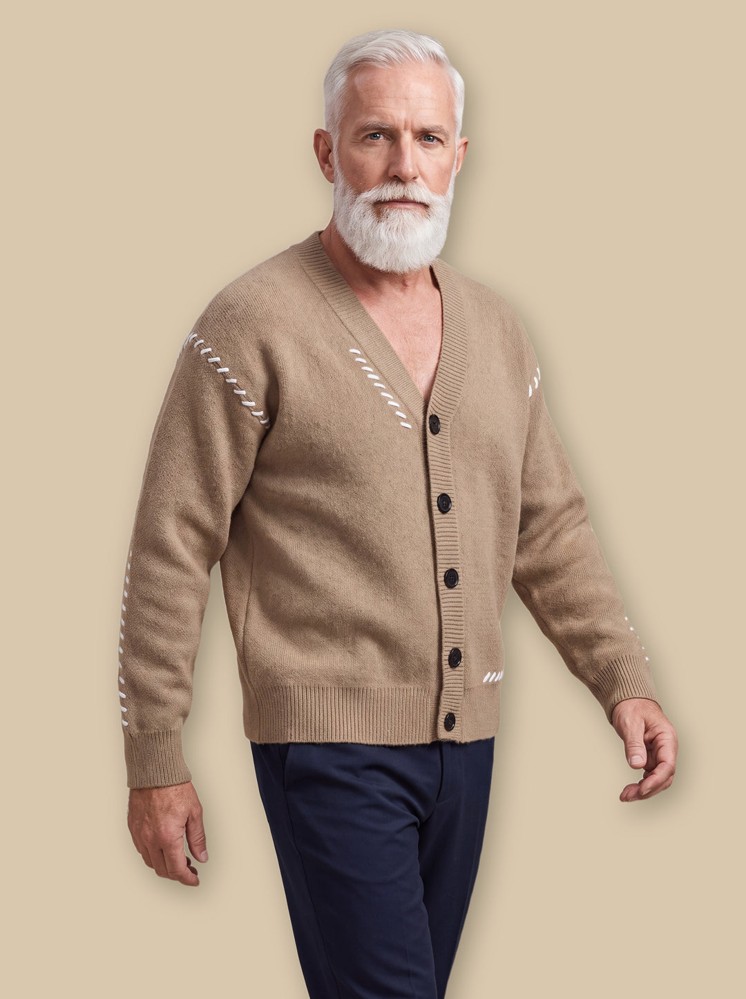 Pierce knit sweater in Sand, worn by a model on a warm sand studio background - Gentlemens Manor