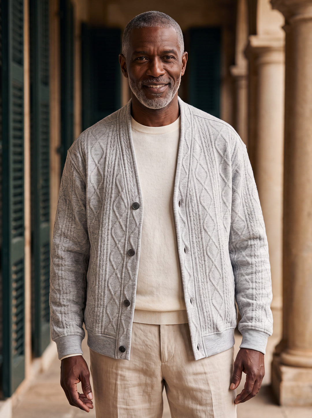 Prentice cardigan in Grey, worn by a model in a Mediterranean setting - Gentlemens Manor lifestyle