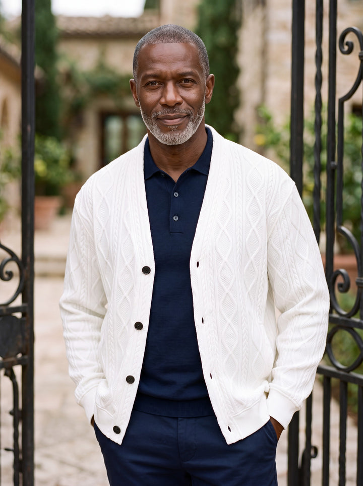 Prentice cardigan in White, worn by a model in a Mediterranean setting - Gentlemens Manor lifestyle