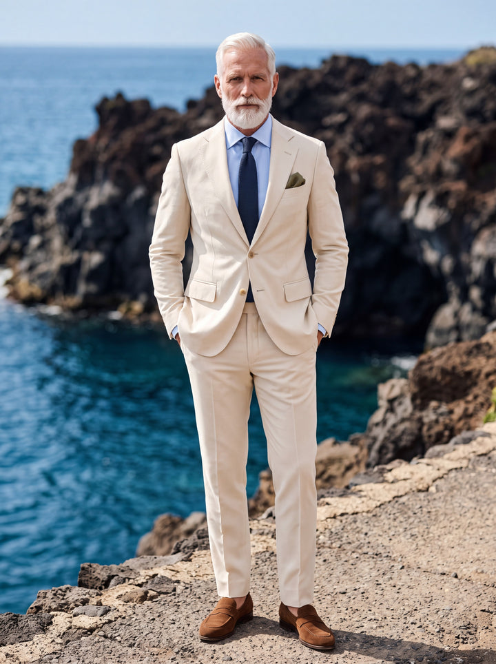 Preston Men two-piece suit in beige, worn by a model in a Mediterranean setting - Gentlemens Manor lifestyle
