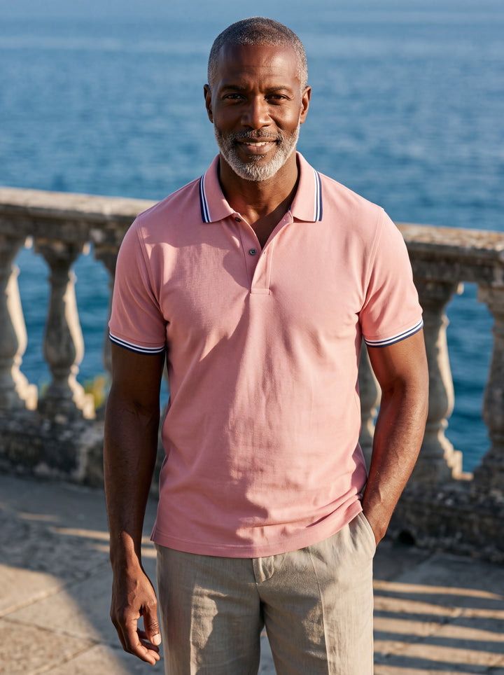 Preston Men polo shirt in pink, worn by a model on a Mediterranean terrace - Gentlemens Manor lifestyle