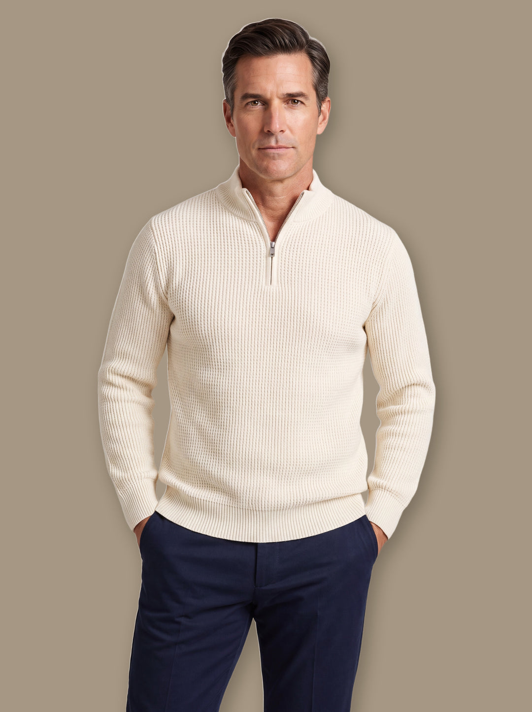 Prosper knit sweater in Cream, worn by a model on a warm taupe studio background - Gentlemens Manor
