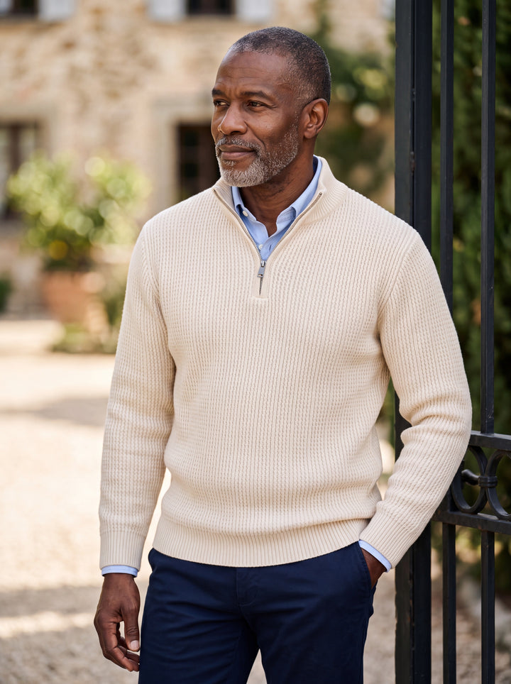 Prosper sweater in Cream, worn by a model in a Mediterranean setting - Gentlemens Manor lifestyle