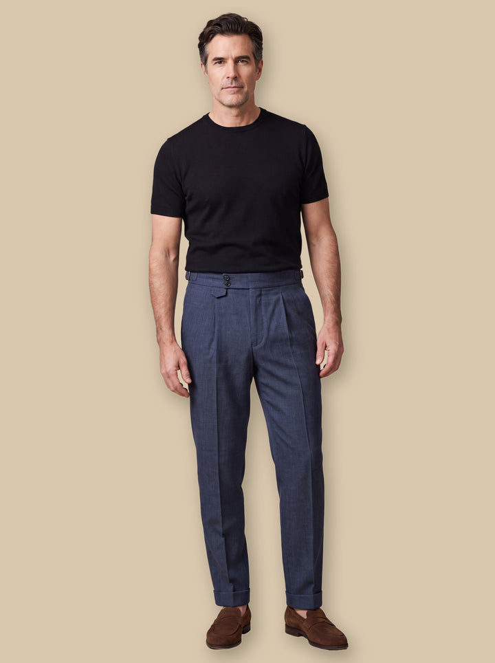 Ramsey trousers in Blue, worn by a model on a warm sand studio background - Gentlemens Manor