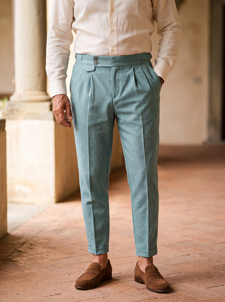 Ramsey trousers in Light Blue, worn by a model in a Mediterranean setting - Gentlemens Manor lifestyle