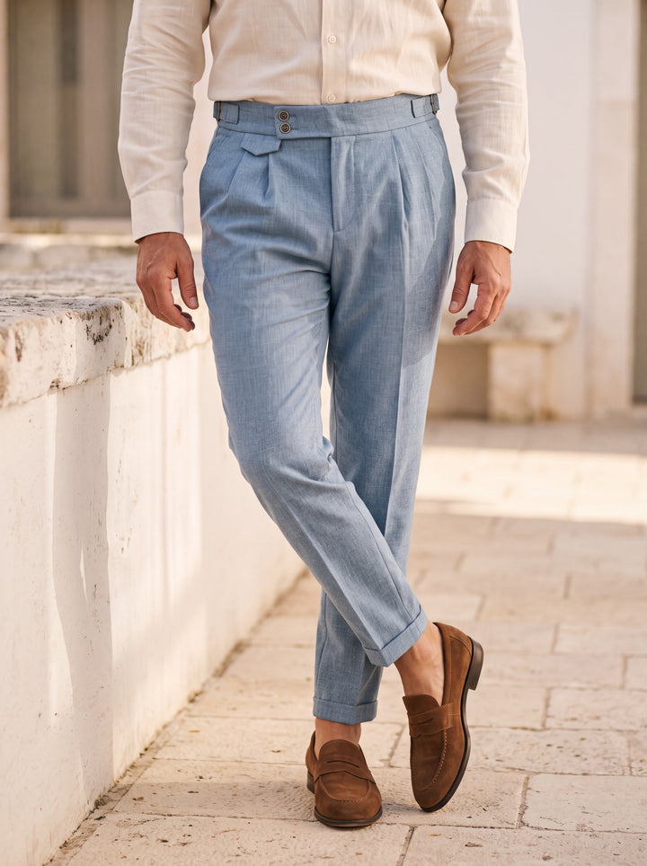 Ramsey trousers in Light Blue, worn by a model in a Mediterranean setting - Gentlemens Manor lifestyle