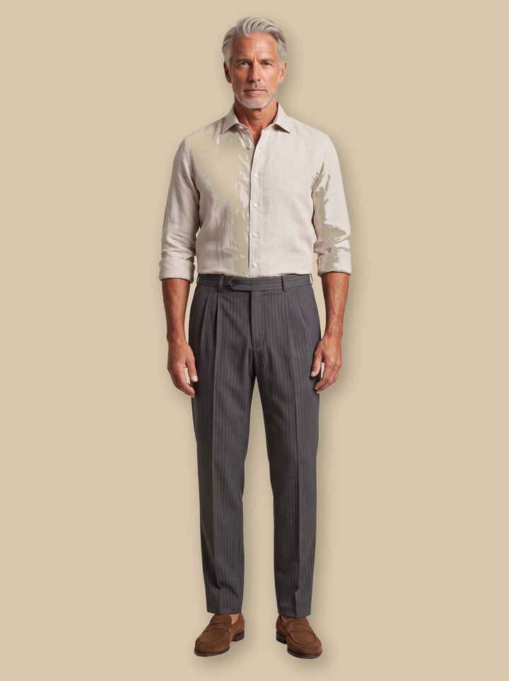 Randall trousers in Black, worn by a model on a warm sand studio background - Gentlemens Manor